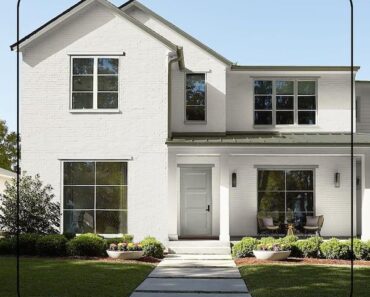 Modern white brick Swiss house exterior with a clean architectural design.