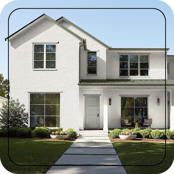 Modern white brick Swiss house exterior with a clean architectural design.